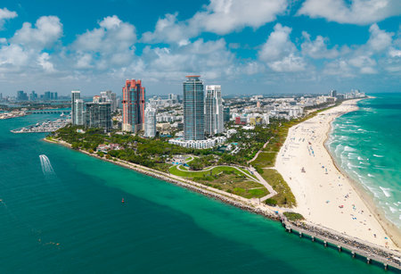 Aerial view of Miami Beach with turquoise waters. Drone shot of Miami skyline. Top view of South Miami Beach. Miami cityscape with luxury skyscrapers and ocean.の写真素材