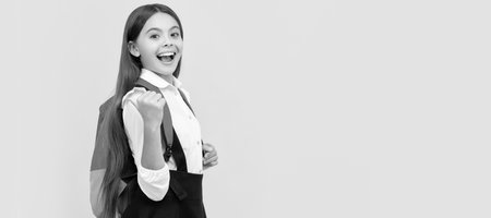 happy knowledge day. concept of education. kid with long hair in uniform, copy space. Banner of schoolgirl student. School child pupil portrait with copy space.の写真素材