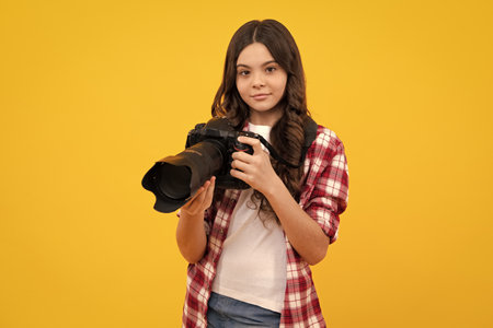 Hobby or career for photographer beginner. Teenage girl with modern camera making video and photo....