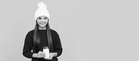 happy child in winter hat with pill jar, health. Horizontal poster of isolated child face, banner header, copy space.の写真素材