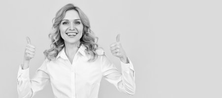 successful businesswoman. female boss ceo. thumb up. cheerful blonde woman in white shirt. Woman isolated face portrait, banner with mock up copy space.の写真素材