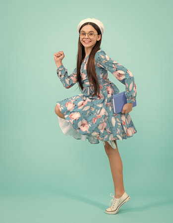 Teenage school girl with books. Schoolgirl student. Happy teenager, positive and smiling emotions.