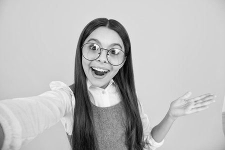 Amazed teenager making selfie. Tenn girl in casual look.の写真素材