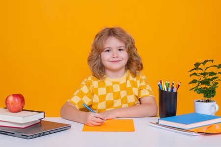 Little student school child isolated on studio background. Portrait of nerd student with school...