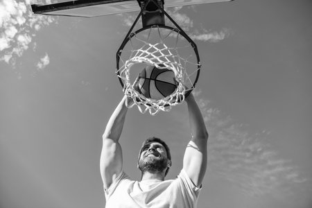 high view of basketball player throws the ball into the hoop outdoor, motivation