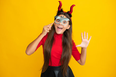 Halloween witch teen girl portrait. Teen girl with pumpkin. Teen witch. Kid girl witch celebrates Halloween. Happy Halloween. Halloween child teenager girl.の写真素材