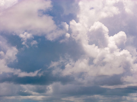 Sky with layers of clouds. Blue sky and puffy clouds background. Cloudscape view full of natural...