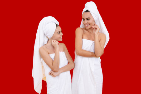 Beauty mother and daughter, embracing beauty together. Facial cosmetics family. Beautiful skin for mother. Family care and beauty. Skin cream. Natural beauty for family. Rejuvenate skin. Skin care.の写真素材