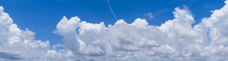 Sky with layers of clouds. Blue sky and puffy clouds. Cloudscape view full of natural light. Cloud...