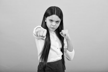 Angry face, upset emotions of teenager girl. Angry portrait young girl having nervous breakdown. Negative kids emotions facial expressions feelings, bad attitude.の写真素材