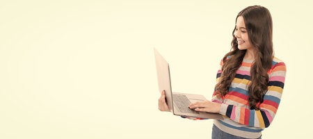 young kid on video lesson. girl use laptop for blogging. webinar online education. School girl...