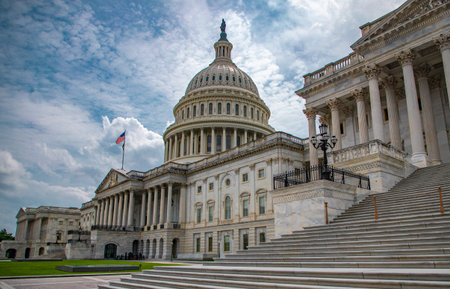 The Congress. Washington, DC landmark. American flag above the Congress. Washington DC skyline. Senate and House in Washington, DC, USA.の写真素材
