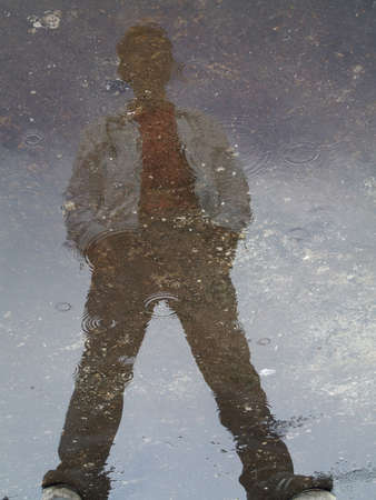 reflection of the boy in the rainの写真素材