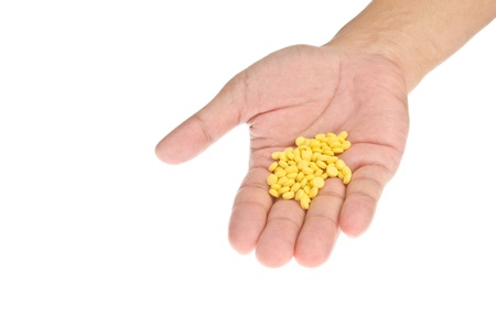 Drugs in hand on white background