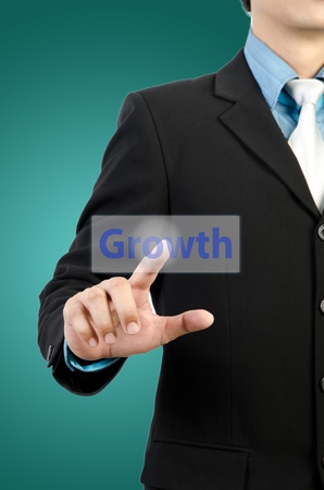 businessman hand touching growth buttonの写真素材
