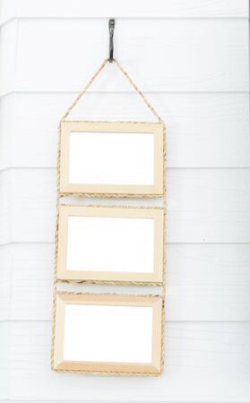 Wooden frames hanging on wall.