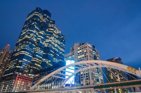 BANGKOK THAILAND-MAY 13: Chong Nonsi Station with Sathorn Thani Building. On MAY 13, 2015 in Bangkok, Thailand. Chong Nonsi Station is a BTS sky-train station, on the Silom Line in Bang Rak District.のeditorial素材