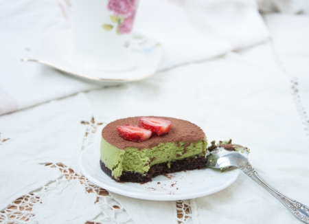 Tiramissu cake "green tea" with strawberriesの写真素材