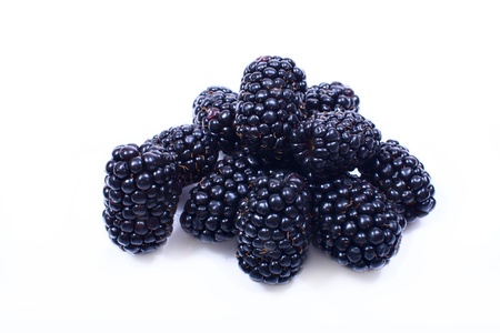 Handful of juicy, tasty blackberries on a white background closeup.の写真素材