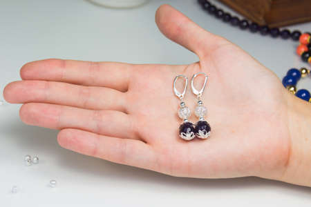 Pair of Amethyst Silver Earings on palmの写真素材