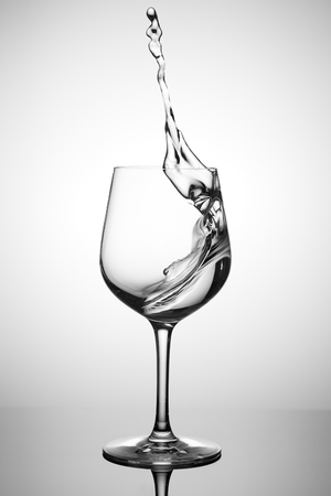 pure water splashing out of a glassの写真素材