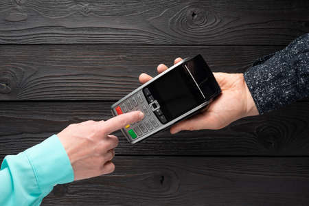 Set of a pin code on a bank terminal, top viewの写真素材