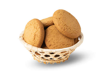 basket with oatmeal cookies isolated on white backgroundの写真素材