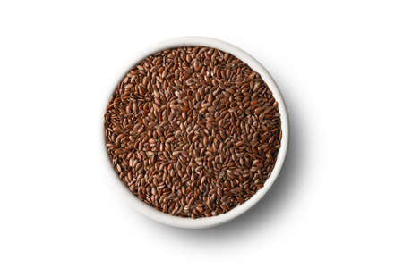 flax seeds in a cup isolated on white background, top viewの写真素材