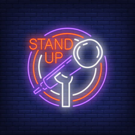 Stand up neon sign, stand microphone in round frame on brick wall background. Night bright advertisement vector illustration in neon style for comedy show.のイラスト素材