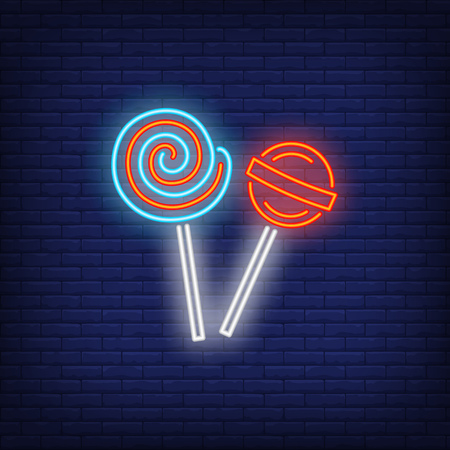 Lollipops neon sign. Invitation, dessert or advertisement design. Night bright neon sign, colorful billboard, light banner. Vector illustration in neon style.のイラスト素材