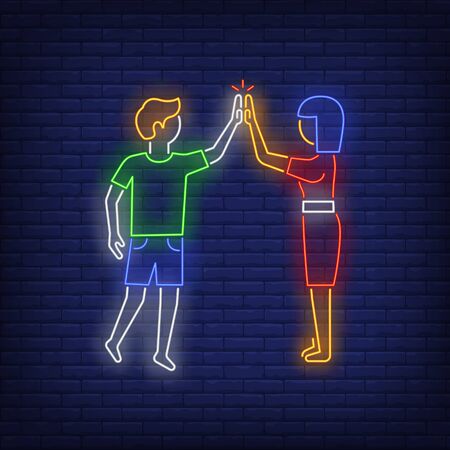 Man and woman giving high five to each other neon sign. Friendship, advertisement design. Night bright neon sign, colorful billboard, light banner. Vector illustration in neon style.のイラスト素材