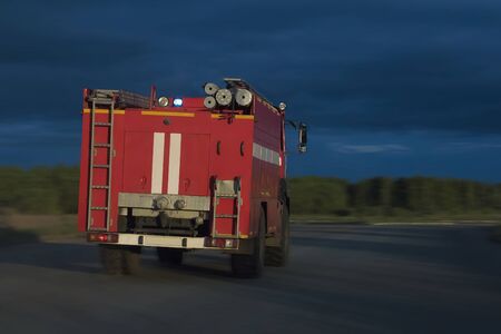 a fire truck rides on the highway