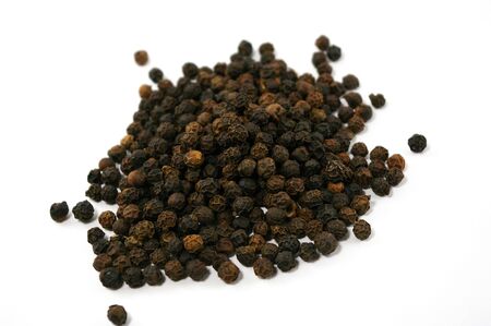 black pepper isolated on whiteの写真素材