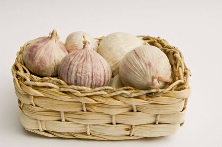 garlic bulbs in basketの写真素材