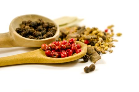 mix of different spices on white background, shallow depth of field