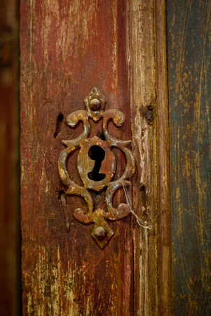 old rusted keyhole on a wooden aged  doorの写真素材