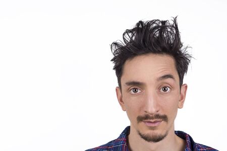 Isolated portrait of a man with out of bed hair.の写真素材
