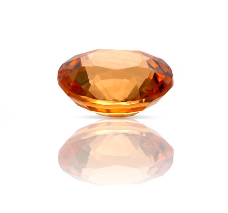 Natural Spessartite garnet on a white background, round cutの写真素材