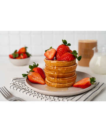 Tasty pancakes with fresh strawberry and sweet honey on plate. Healthy breakfastsの写真素材