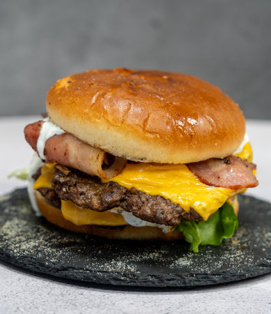 Burger with meat cutlet, hamburger isolated on grey background. Tasty Hamburger. Restaurant dish.の写真素材