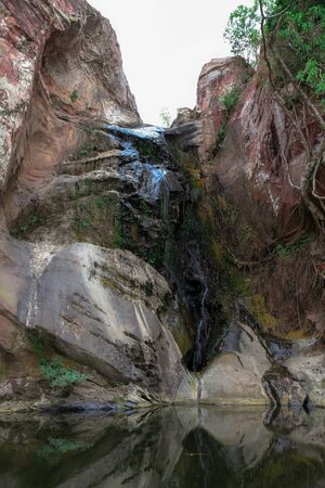 Waterfalls with large rock cliffs during the dry season.の写真素材
