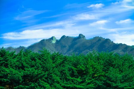 Mountains are beautiful with lush vegetation and beautiful blue sky.の写真素材