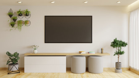 Modern TV room is decorated with plants and sofas. It has a large TV on a beautiful white wall.3d renderingの写真素材