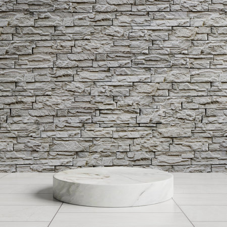 White marble podium on a white tiled floor with gray brick wall as background.3d renderingの写真素材