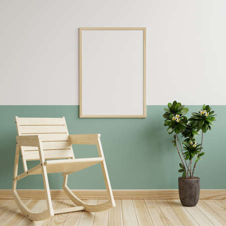 Photo frame mockup on a white and green wall in the living room. With rocking chairs and plant pots...