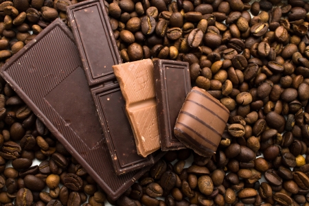 Different types of chocolate on  coffee beans backgroundの写真素材