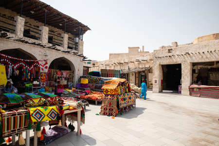 Doha, Qatar - March 2, 2020: View on traditional arabian market Souq Waqif selling carpets and clothes in Doha City in Qatarのeditorial素材
