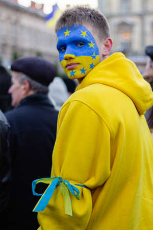 Lviv, Ukraine - December 8, 2013: Protesters with political signs and national ukrainian flags during Revolution of Dignity euromaidan, democracy protests for agreement with EUのeditorial素材