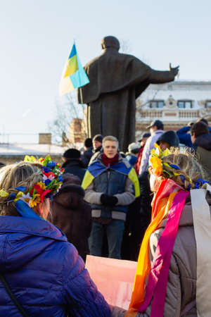 Lviv, Ukraine - December 8, 2013: Protesters with political signs and national ukrainian flags during Revolution of Dignity euromaidan, democracy protests for agreement with EUのeditorial素材