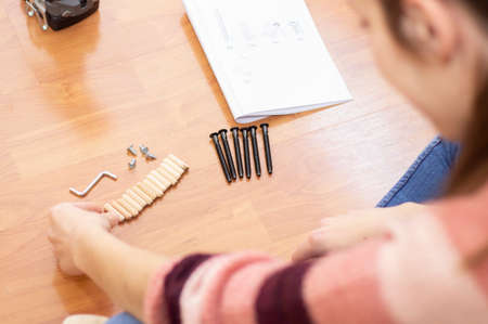 screws and mounting hardware on the living room floorの写真素材
